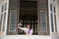 The lady in Middle Thai classical traditional dress suit posing indoor at old railway station building. Royalty Free Stock Photo