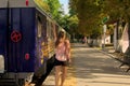 Lady missed her train. Young girl with a ticket in her hand trying to catch up with her carriage of departing train