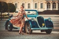 Lady near classic convertible Royalty Free Stock Photo