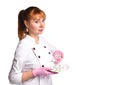 Lady, nurse or doctor, in medical suit and pink disposable gloves. Holding plate with colorful pills, posing isolated on white Royalty Free Stock Photo