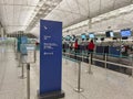 passengers with face mask check in Cathay Pacific counter in Hong Kong International airport during Covid-19