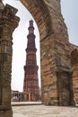 Lady passing through courtyard in Qutub complex in Mehrauli.