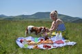 Lady Playing with Her Dog on Picnic