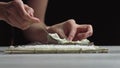 Lady preparing sushi roll - people with favorite dish Japanese food concept Royalty Free Stock Photo