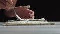 Lady preparing sushi roll - people with favorite dish Japanese food concept Royalty Free Stock Photo