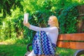 Lady pretty bookworm busy read book outdoors sunny day. Literary critic. Woman concentrated reading book in garden Royalty Free Stock Photo