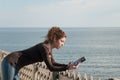 Lady reading a book at the seaside Royalty Free Stock Photo