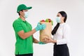 Lady recieving food ingredients from grocery driver