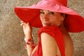 The lady in red with fantastic hat Royalty Free Stock Photo