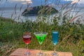 A lady relax on the hilltop with some drink drinks on hill top in front of wind turbine view point