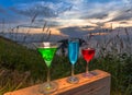 A lady relax on the hilltop with some drink drinks on hill top in front of wind turbine view point