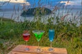 A lady relax on the hilltop with some drink drinks on hill top in front of wind turbine view point