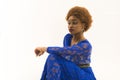 Lady on relaxed face with makeup and afro hairstyle. Lady in dress made out of lace. African females beauty concept