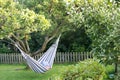 Lady resting in hammock in lush green garden Royalty Free Stock Photo