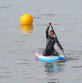 Lady rower on surfboard