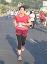 Lady running at Hyderabad 10K Run Event, India