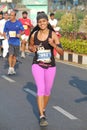 Lady running at Hyderabad 10K Run Event, India