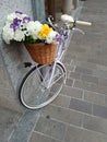 Lady's bicycle with a basket full flowers