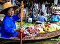 Lady selling fruit from her boat at Floating Market,