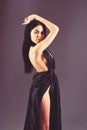 Lady, girl in dress. Fashion and vogue concept. Woman in elegant black long evening dress with nude back, dark Royalty Free Stock Photo