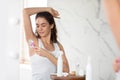 Lady Shaving Armpits With Safety Razor Removing Hair In Bathroom Royalty Free Stock Photo