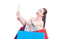 Lady shopper taking selfie with tablet and being funny