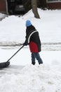 Lady Shoveling Snow from Driveway Royalty Free Stock Photo