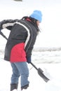 Lady Shoveling Snow from Driveway Royalty Free Stock Photo