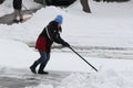 Lady Shoveling Snow from Driveway Royalty Free Stock Photo