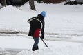 Lady Shoveling Snow from Driveway Royalty Free Stock Photo