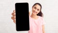 Lady showing white empty smartphone screen, closeup