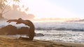 Tremendous lady in tracksuit silhouette stretches in morning