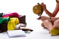 Lady sits beside filled suitcase. Royalty Free Stock Photo