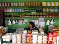 A lady sits in her sweet snacks and delicacy store in a tourist spot in Tagaytay City, Philippines.