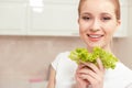 Lady smiles while holding salad Royalty Free Stock Photo