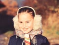 Lady with smiling face poses with candy on nature background Royalty Free Stock Photo