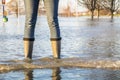 Lady standing in flooded street