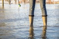 Lady standing in flooded street