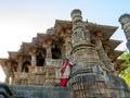 A lady standing at Low angal veiw of the assembly hall frome stapes to Kunda, the reservoir Sun Temple, Modhera Royalty Free Stock Photo