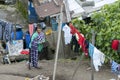 A lady stands in front of her home in a shanty town set up on the outskirts of Quito in Ecuador.