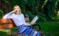 Lady student read boring literature outdoors. Boring literature. Woman yawning blonde take break relaxing in garden