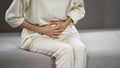 Lady suffering from strong stomach ache, gastritis, problems with gall bladder Royalty Free Stock Photo