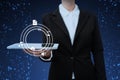Lady in suit holding tablet presenting innovative thinking symbolizing futuristic technology. Woman carrying electricall Royalty Free Stock Photo