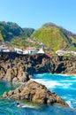 Lady swimming in natural swimming pools in the Atlantic ocean, Madeira Island, Portugal. Made up of volcanic rock, into which sea Royalty Free Stock Photo