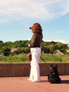Lady taking photograph with dog