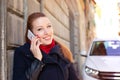 Lady talking on the mobile phone while walking on a street Royalty Free Stock Photo