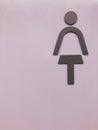 Lady Toilet sign on the purple wallpaper. Royalty Free Stock Photo