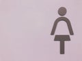 Lady Toilet sign on the purple wallpaper. Royalty Free Stock Photo