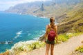 Lady tourist with a backpack standing on mountain enjoy the beautiful landscape of Tenerife Island Royalty Free Stock Photo