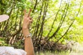 Lady travel Ecotourism Write down the information notebook in the wood Golden Meadow Prong thailand Royalty Free Stock Photo